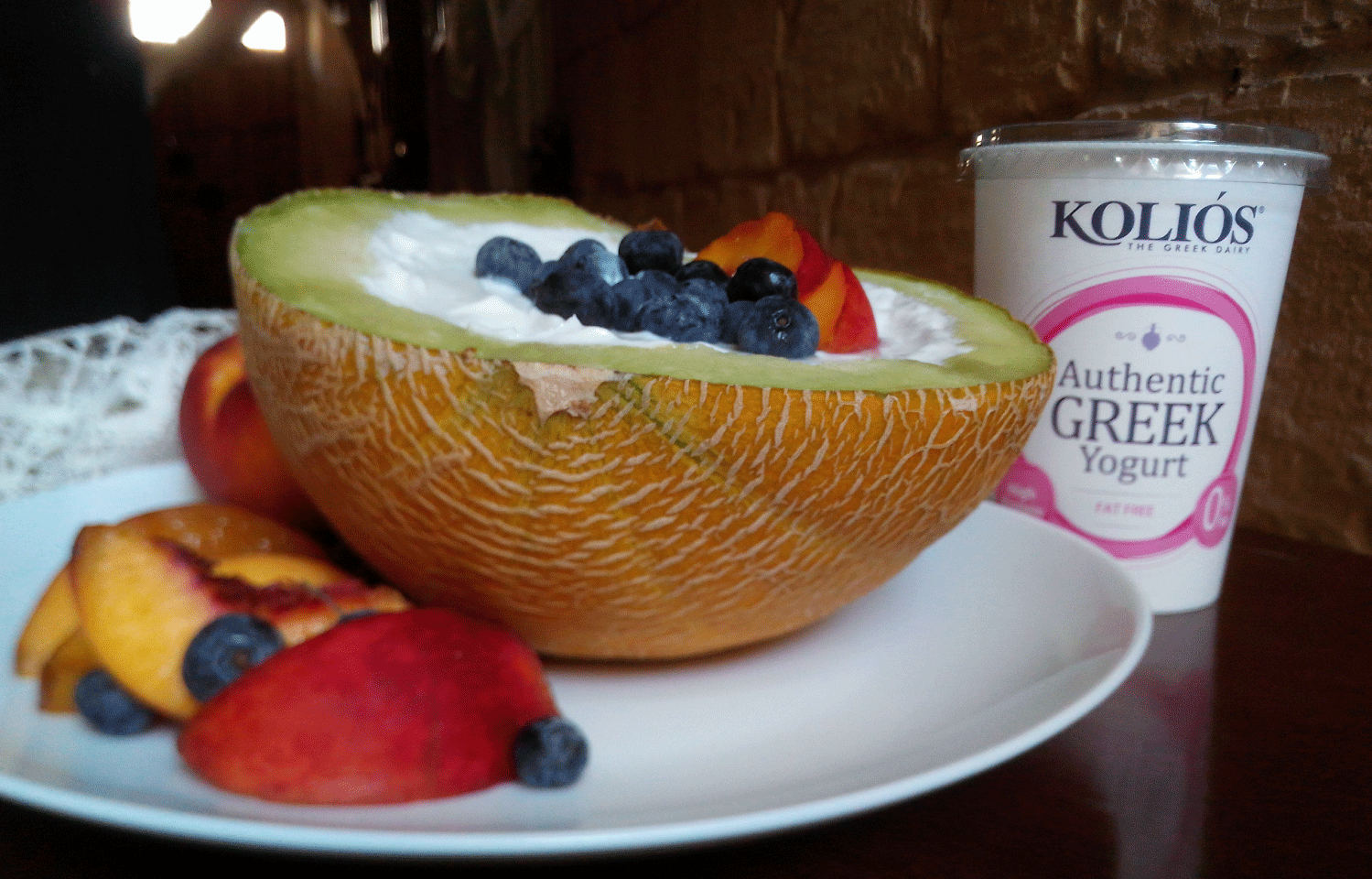 Blueberries and Kolios greek yogurt mix in fresh Cantaloupe bowl